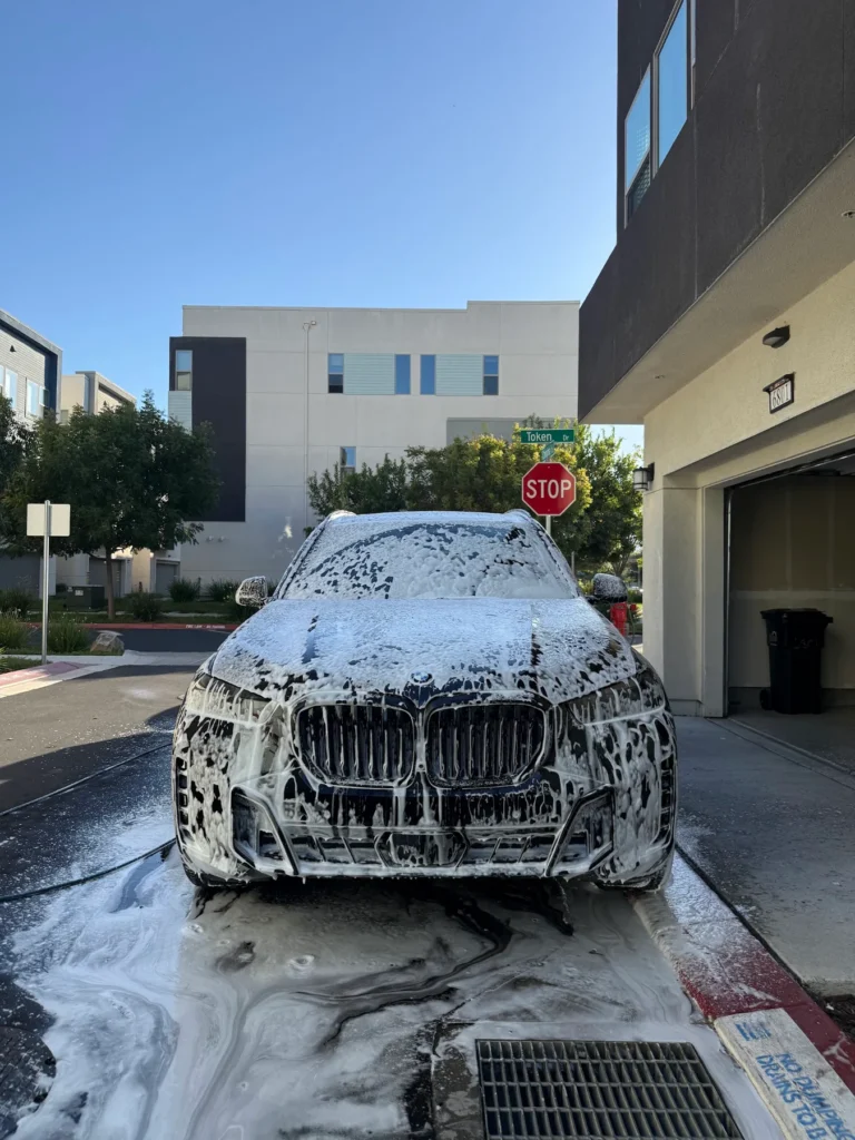 BMW SUV covered in foam during a mobile hand wash