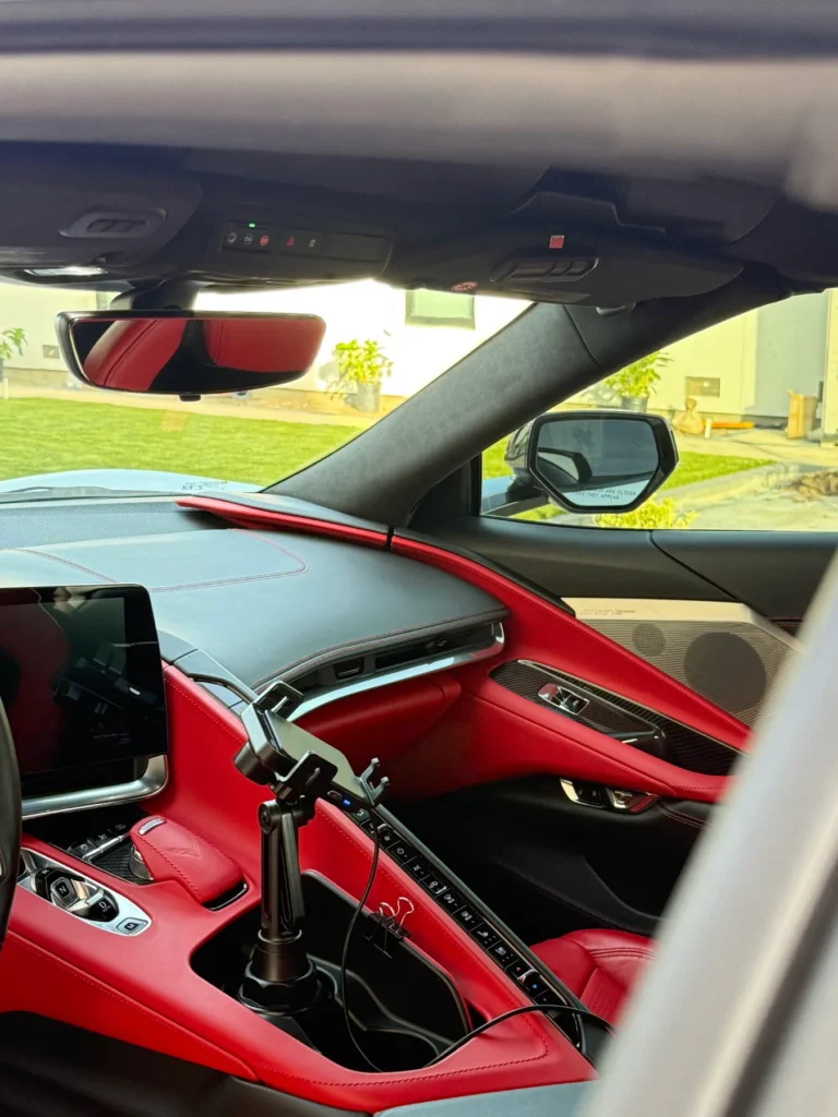 Clean red and black Corvette interior after an interior detail