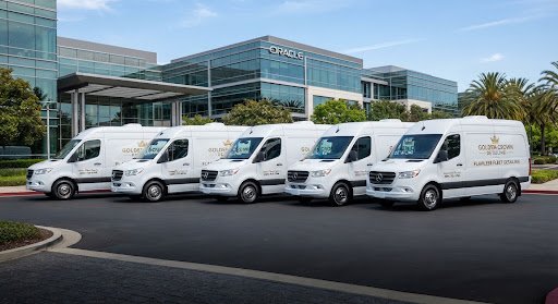 Fleet of white vans in a parking lot